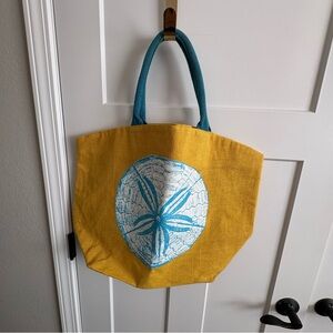 Two's Company Reef Jute Sand Dollar Tote  – Eco-Friendly Yellow/Teal Beach Bag